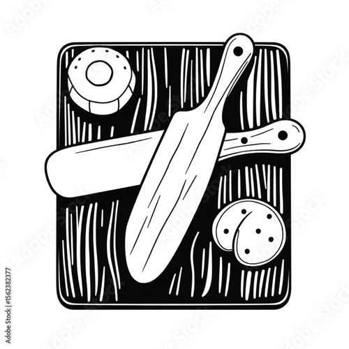 A wooden butter knife on a breadboard