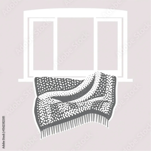 A woollen throw on a window seat