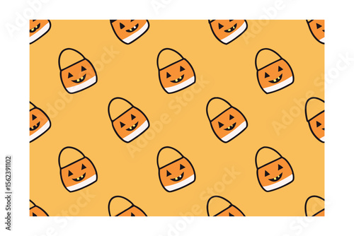 Orange Halloween candy bucket pattern with smiling jack o lantern faces on a yellow