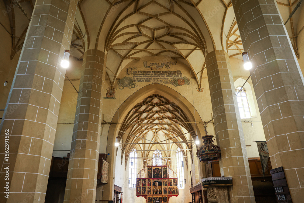 Fototapeta premium Interior of the Saxon Church with Organ in Biertan Saxon Village, Sibiu County, Romania – Medieval Architecture and Cultural Heritage Landmark