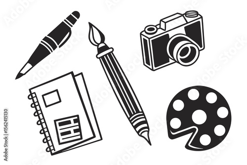 A pen, paintbrush, camera, notebook, and palette isolated on white