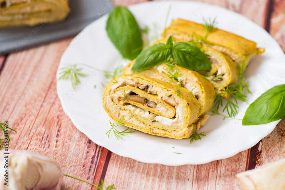 Fototapeta premium Hearty zucchini roll with piquant filling