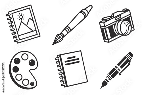 A pen, paintbrush, camera, notebook, and palette isolated on white