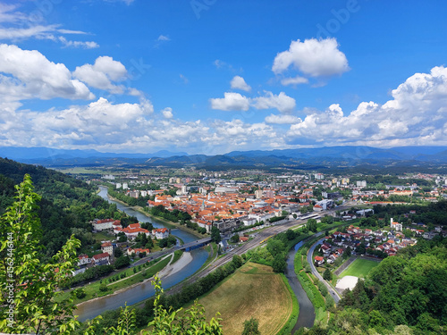 city Celje with rivers Savinja and Voglajna. Green landscape under blue sky. Slovenia