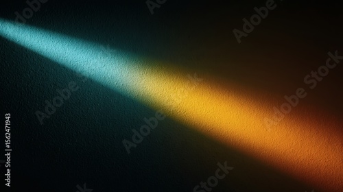 Diagonal beam of light transitions from cool blue to warm orange on textured wall