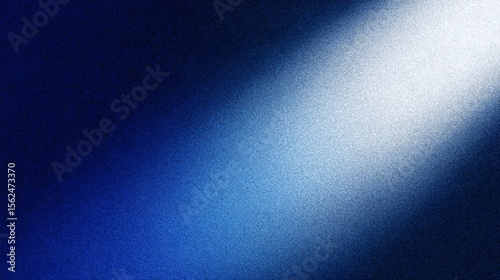 Abstract grainy blue gradient background with a bright diagonal light beam