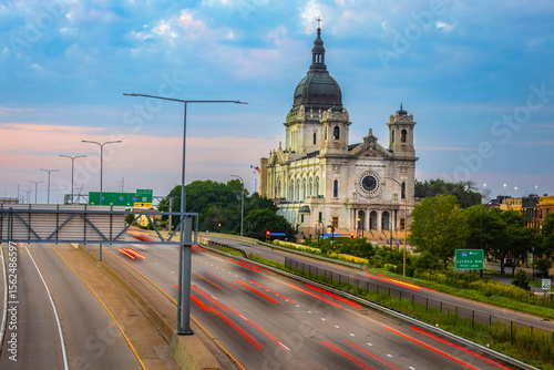 Vibrant view of Basilica of Saint Mary at dusk across busy highway