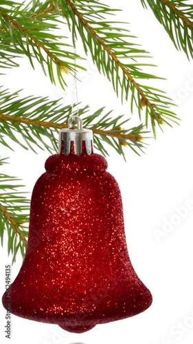 Animation of fir trees branches and decorations over white background