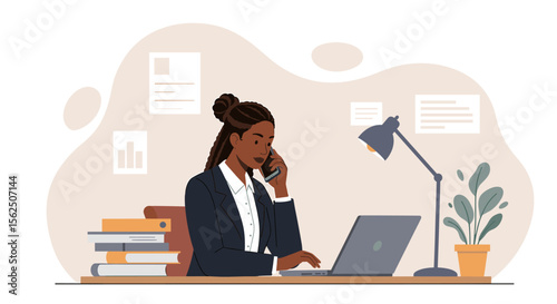 Confident African American businesswoman in a suit uses her laptop while talking on her phone in a modern office, showcasing productivity and communication.