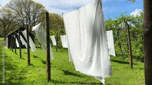 laundry day, linen is hanging outdoor on clothesline