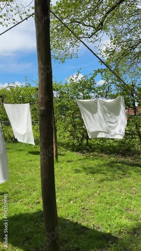 laundry day, linen is hanging outdoor on clothesline