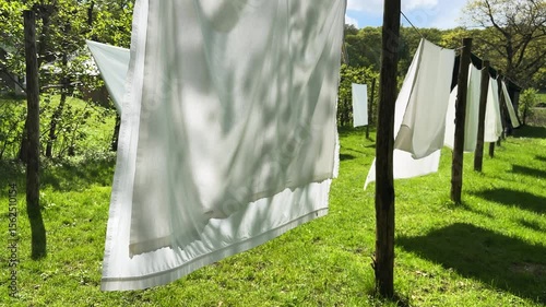 laundry day, linen is hanging outdoor on clothesline