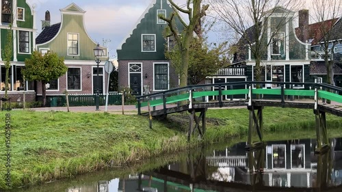 traditional Dutch small town scenery in Zaanse Schans over water at summer sunset, Netherlands