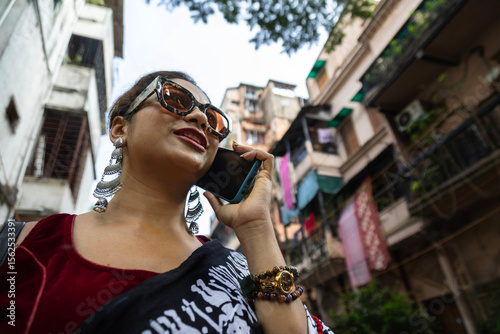 fashionable Indian woman wearing traditional sari in a metro city  photo