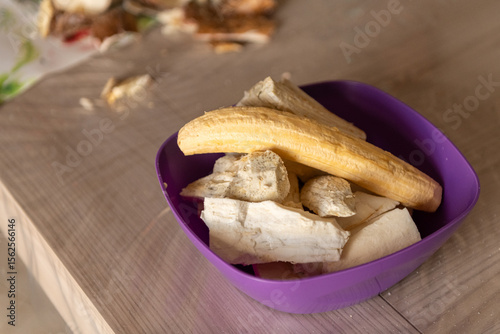 Peeled cassava root and plantains in the bowl ready to cook