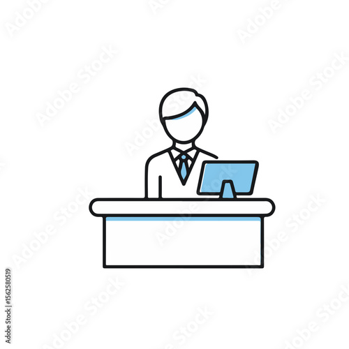Hotel concierge standing at front desk with a computer screen  