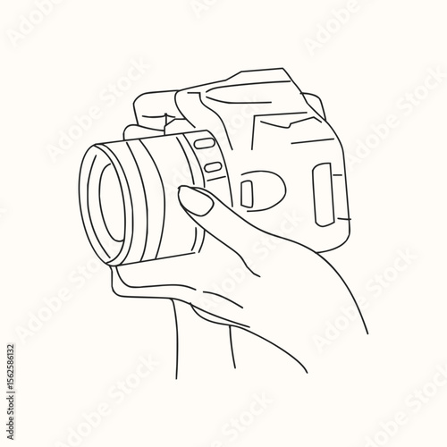 A hand holding a camera with a lens, presented in a simplistic black and white line drawing style image
