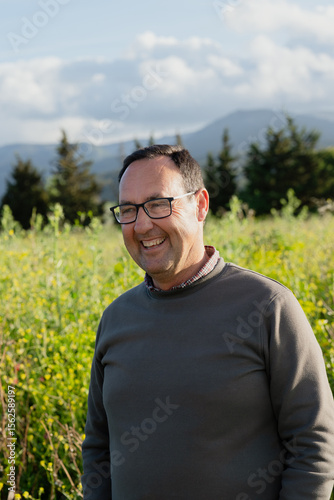 Farmer smiling in cultivated field