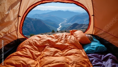 Cozy Sleeping Area in a Tent Overlooking Majestic Mountains and River in Bright Sunshine