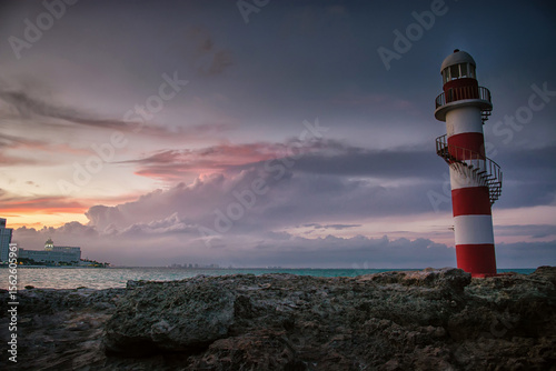 Photography Lighthouse at sunset overlooking the Caribbean sea and sky in Mexico