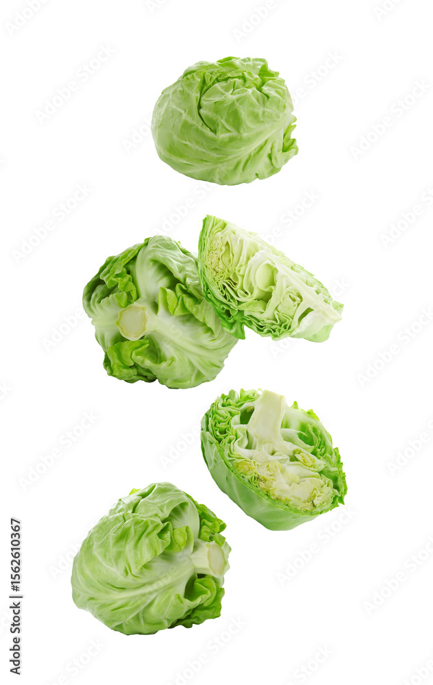 Fototapeta premium Fresh ripe cabbages falling on white background