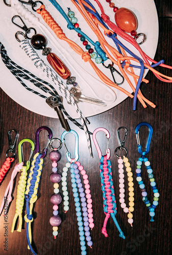 Colorful keychains and handmade accessories displayed on a table photo