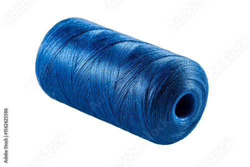 A blue spool of thread is sitting on a white background