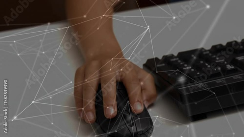 Right hand entering frame adjusting grip on mouse clicking and sliding for network overlay control