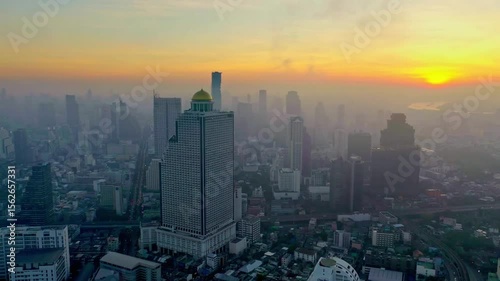 Sunrise over the bangkok skyline with skyscrapers in the distance