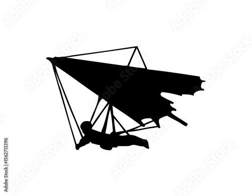 Silhouette of a hang glider with a person soaring through the air.