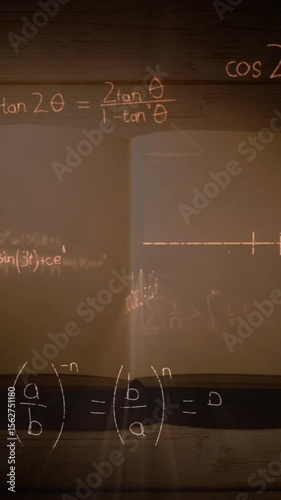 Mathematical equations and figures and an open notebook