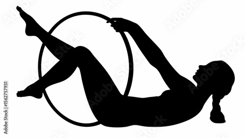 Silhouette of a woman doing pilates with a hoop ring exercise on the floor in a black and white image