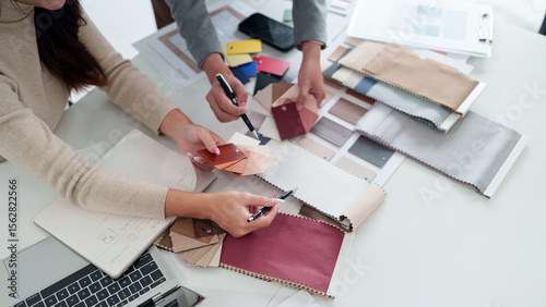 Bild auf Leinwand Interior Design Fabric Selection Meeting Featuring Asian Women Choosing Material
