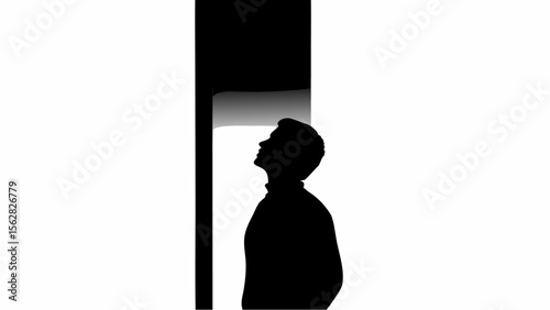 Silhouette of a man looking up at a bright light coming from above with a black vertical stripe nearby