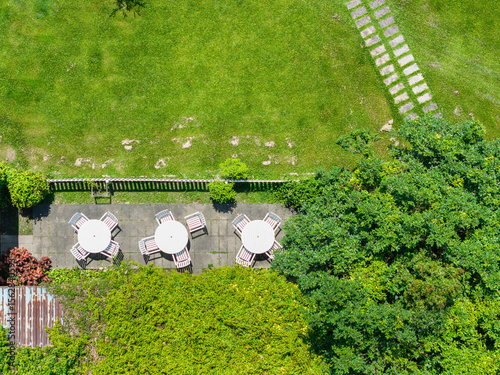 Aerial View of Outdoor Patio with Tables and Chairs in a Garden