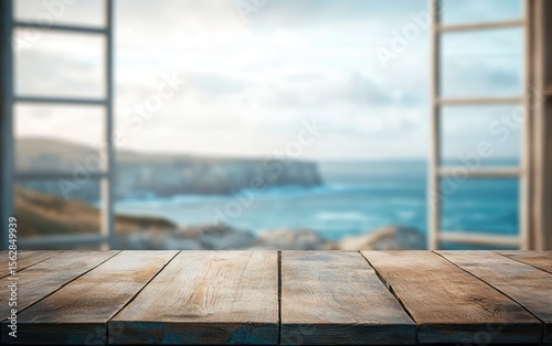 Empty wooden table with a view of the beach and ocean from a window in a summer room interior