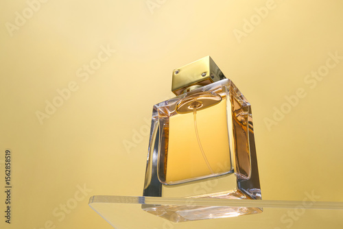 A close-up of a sophisticated perfume bottle on golden background