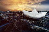 Paper boat floating on the sea