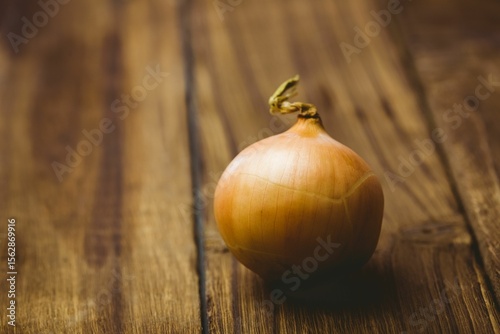 Fresh onion on wooden table