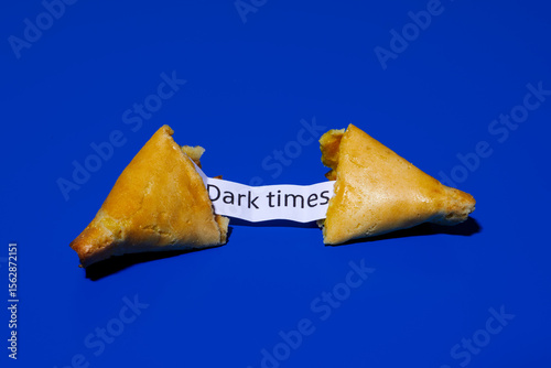 fortune cookie with the message dark times