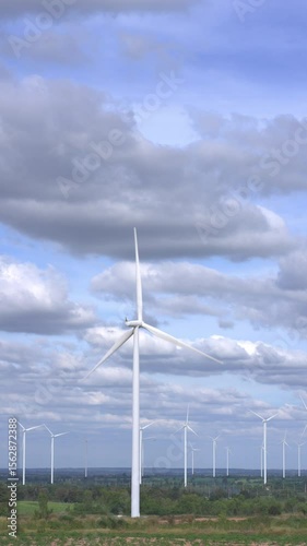 Wind Turbines in a Cloudy Blue Sky Landscape
