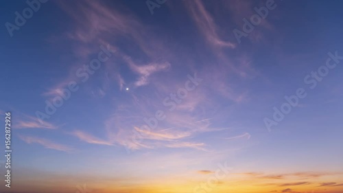 Timelapse of the Evening Sky Transitioning from Sunset to Twilight with Crescent Moon and Bright Venus in Conjunction