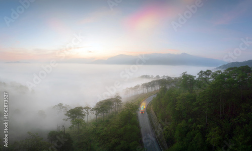 Misty morning road through serene hills in Lac Duong, Lam Dong, 
