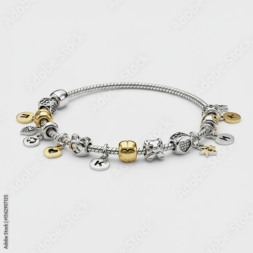 Close up of a silver charm bracelet with gold and silver charms on a white background studio shot