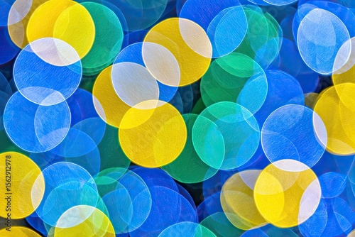 Abstract bokeh circles of blue, yellow, and green light
