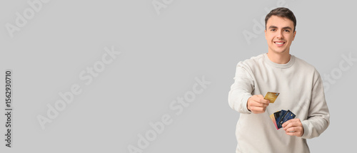Young man with credit cards...