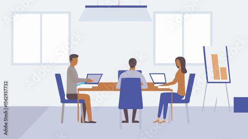 Three people at a table working on laptops in a meeting room with a chart on a whiteboard there