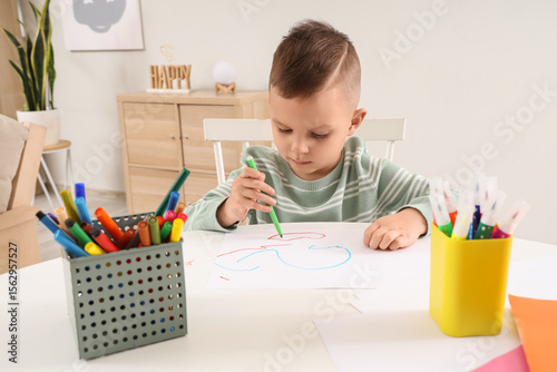 Funny little boy drawing wi...
