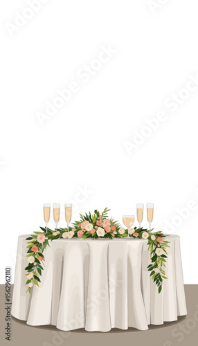 Wedding table setting with champagne flutes and floral arrangement  