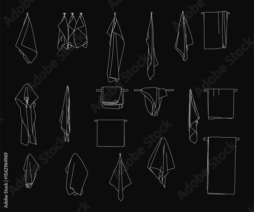 Towels neatly folded and hung on a clothes line against a black background, creating a clean and organized display. The simple arrangement highlights texture and crisp folds, ideal for laundry